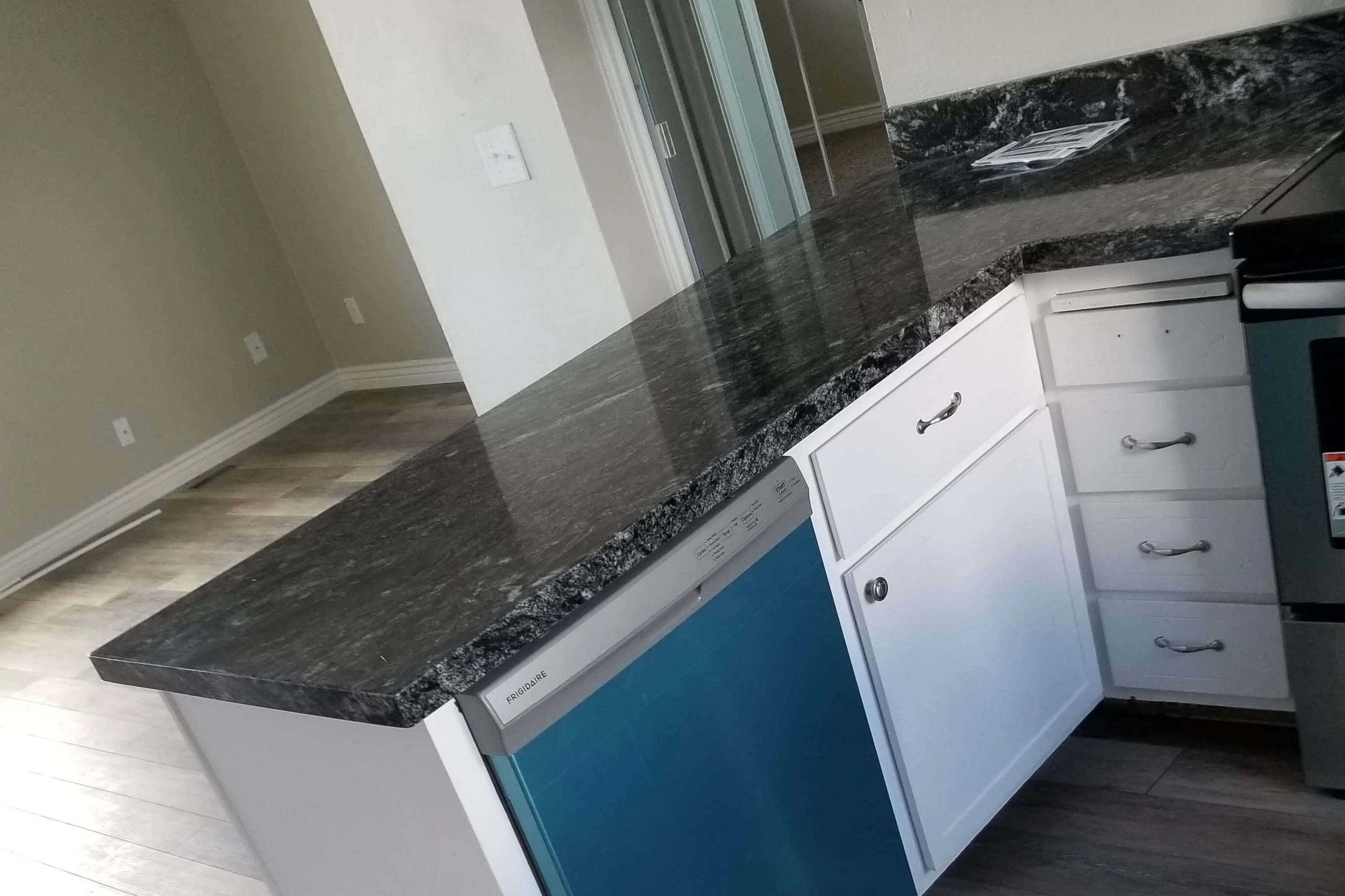 Kitchen remodel with a new kitchen floor cabinets and counters.